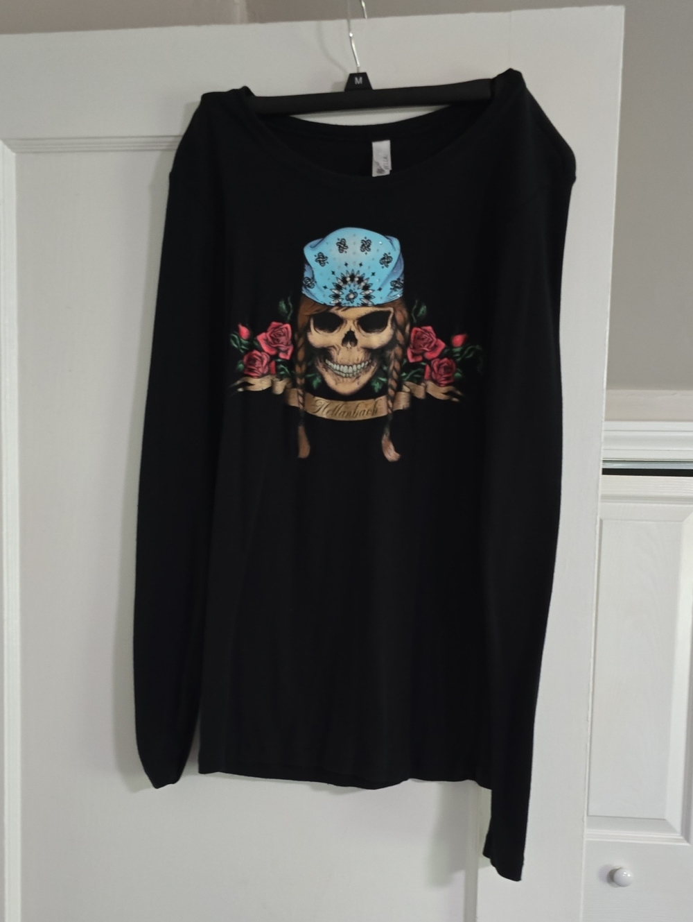 Bella black long sleeve tee with woman pirate skull